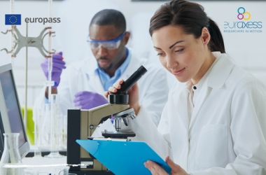 researcher in front of a microscope